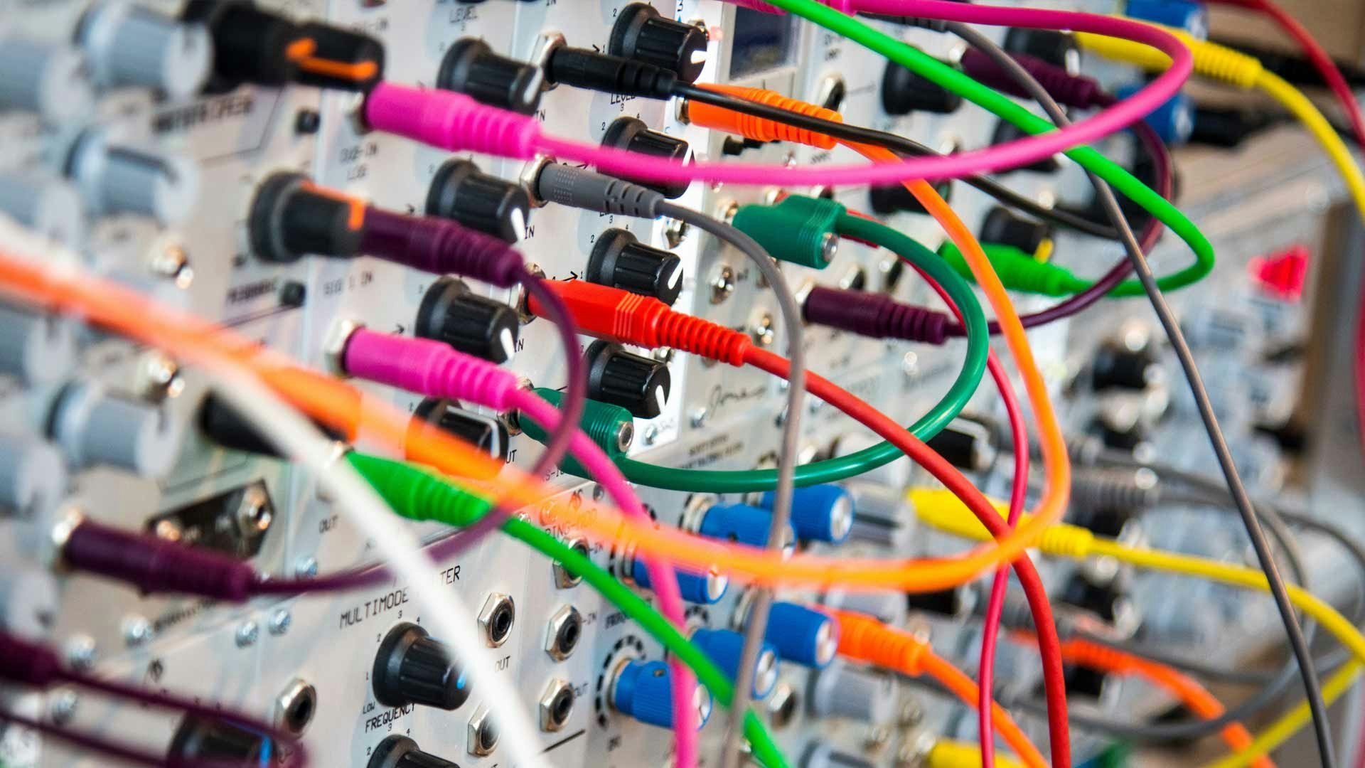 Colorful Cords Plugged into a Transmitter Device